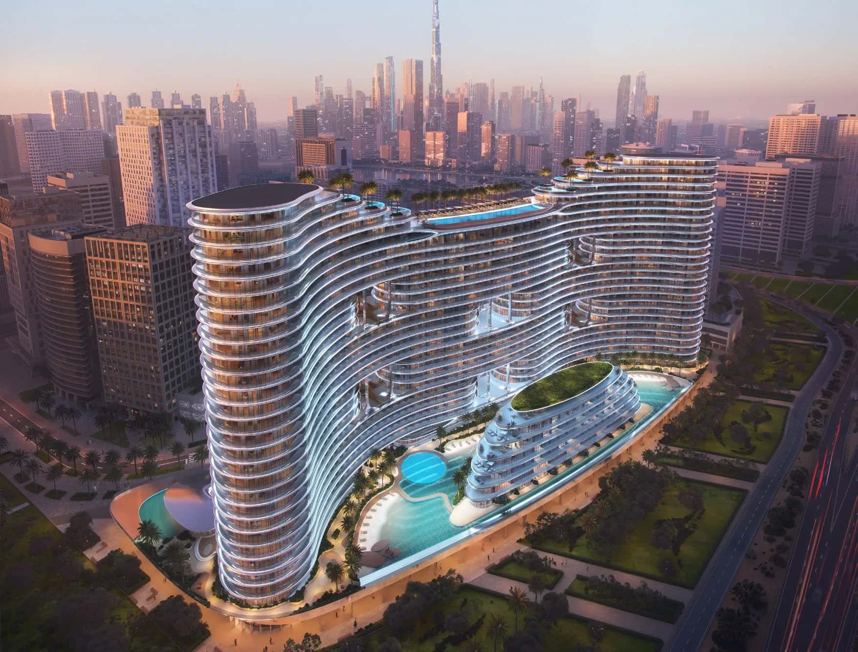 Binghatti Aquarise wave-facade towers overlooking the Dubai Canal in Business Bay