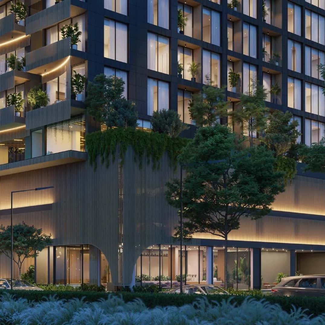 Elemental 22 residential building in Jumeirah Garden City with titanium facade, green terraces, and rooftop pool