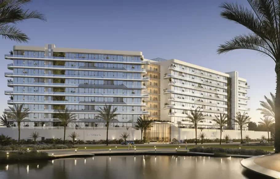 Hammock Park residential tower with sandy lagoon and resort-style amenities in Wasl Gate, Dubai
