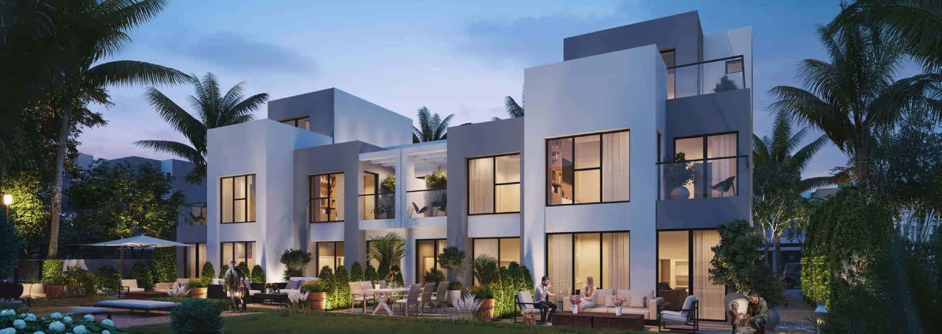 Ivory townhouse exterior at DAMAC Hills, Dubai, showing elegant facade, private garden and natural light-filled interiors