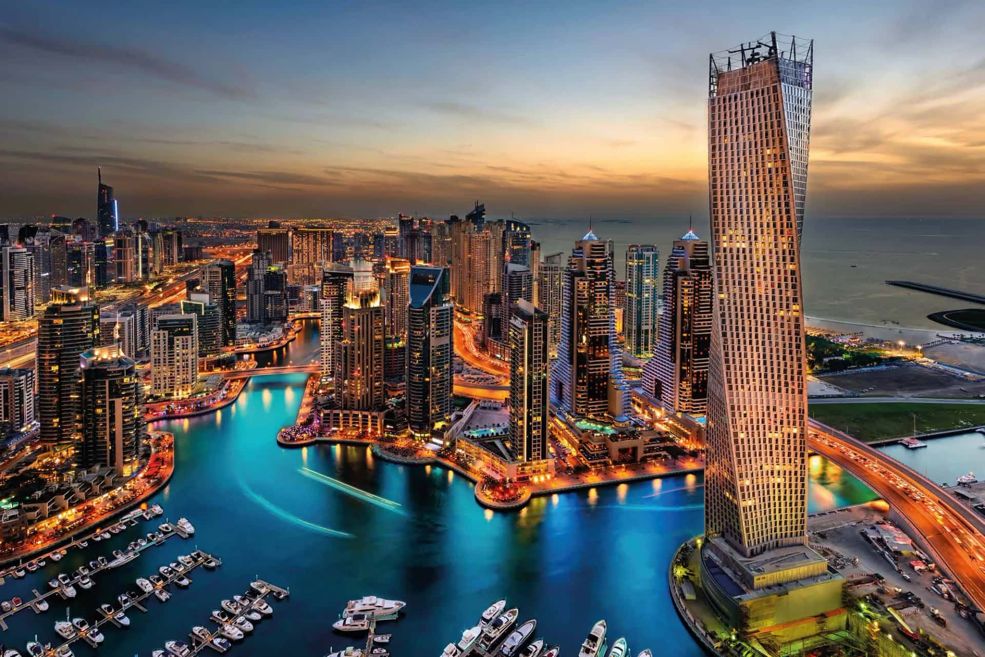 Jumeirah Living Marina Gate tower overlooking Dubai Marina waterway and yachts
