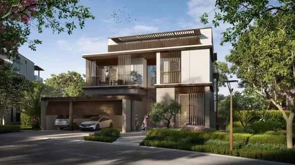 Villa exterior with pitched roof and landscaped garden at Nad Al Sheba Gardens