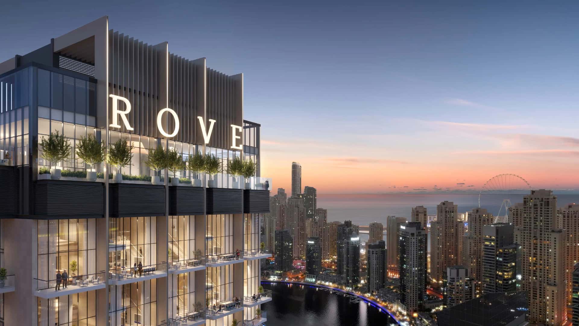 Rove Home Dubai Marina tower exterior with panoramic Marina waterfront views, rooftop infinity pool visible