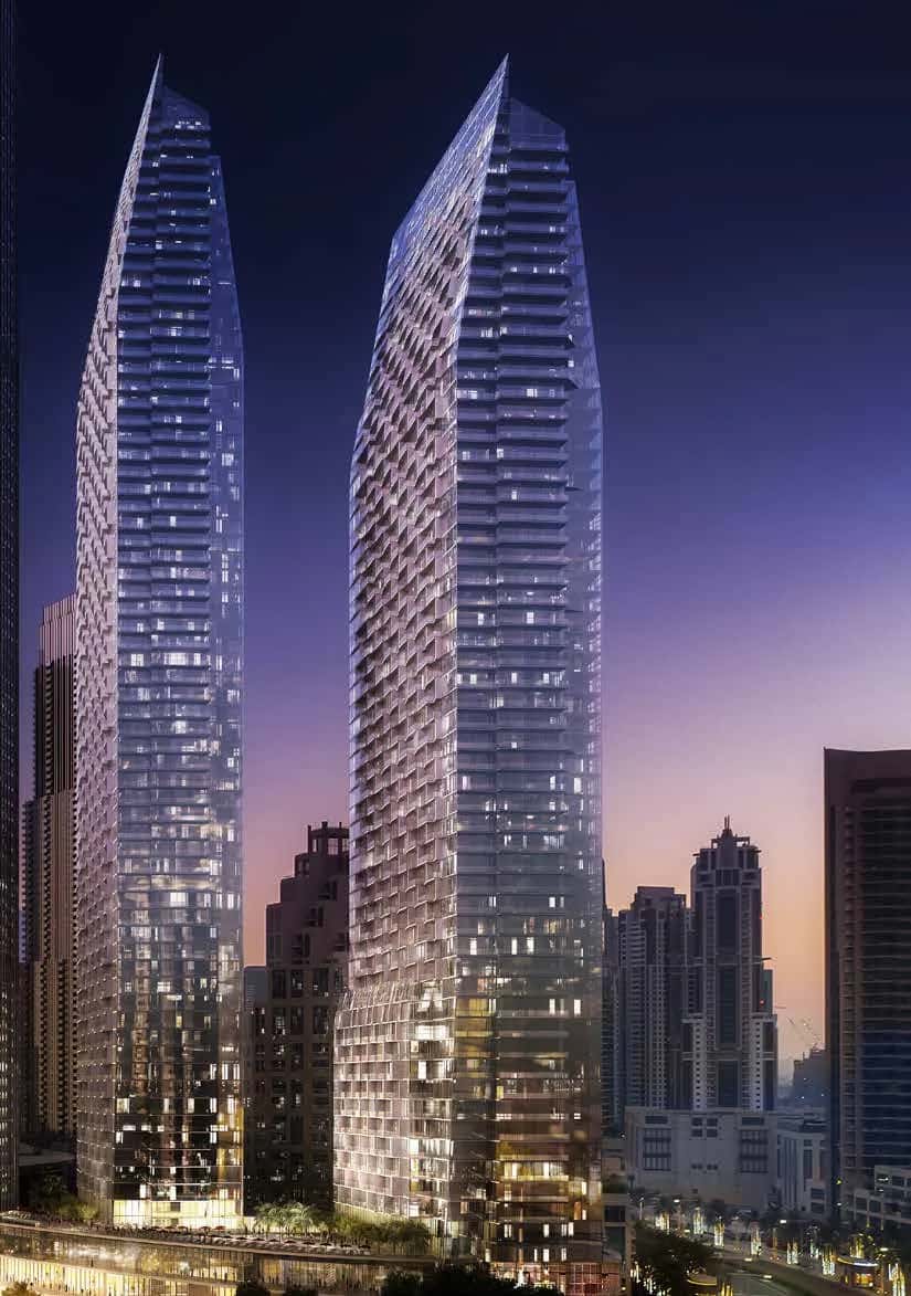 The Address Residences Dubai Opera twin towers rising above the Opera District with Burj Khalifa in the background