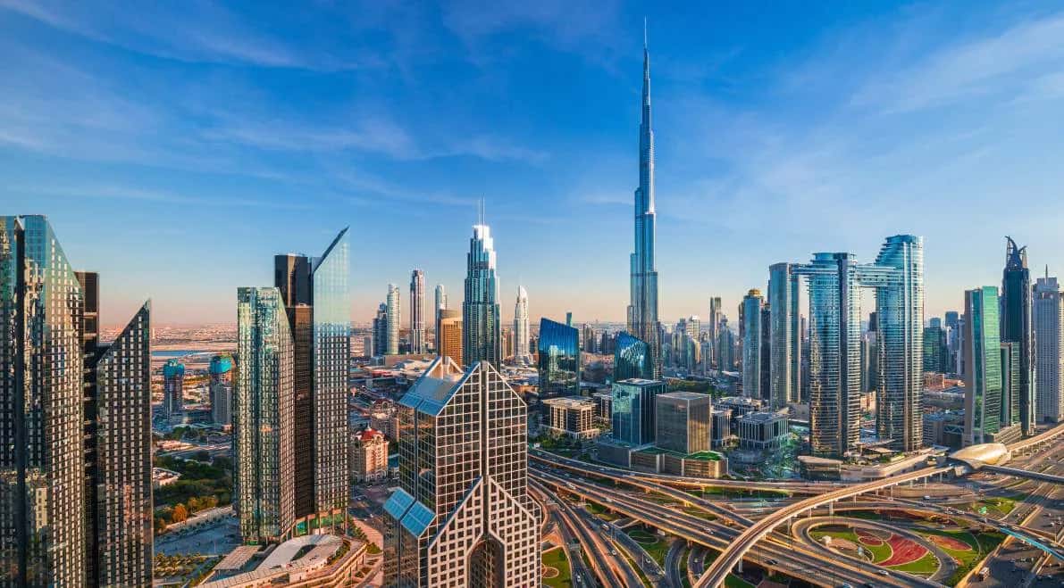 The Orchard Place twin residential towers in Jumeirah Village Circle surrounded by community gardens