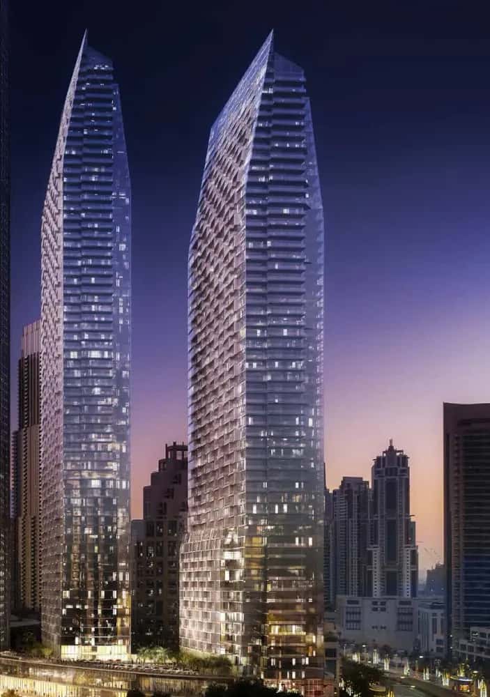 The Address Residences Dubai Opera twin towers rising above the Opera District with Burj Khalifa in the background